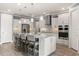 Bright kitchen featuring a granite island, stainless steel appliances, and pendant lighting at 2431 Knoll Dr, Apopka, FL 32712
