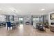 Open living space featuring a dining area, fireplace and views of the back yard at 2431 Knoll Dr, Apopka, FL 32712