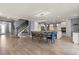 Open living space featuring a dining area and a gourmet kitchen with white cabinets at 2431 Knoll Dr, Apopka, FL 32712