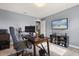 Well-lit office with desk, television, and shelving perfect for working from home at 2431 Knoll Dr, Apopka, FL 32712