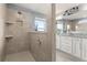 Bathroom featuring a spacious walk-in shower with tile surround and a vanity at 2431 Knoll Dr, Apopka, FL 32712