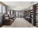 Spacious theater room with tiered seating and large screen, perfect for movie nights at 2431 Knoll Dr, Apopka, FL 32712