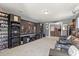 Relaxing theater room featuring comfortable seating, media center and large flat screen TV at 2431 Knoll Dr, Apopka, FL 32712