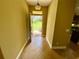 Inviting foyer with tile flooring, a view to the front yard, and neutral paint at 30732 Lipizzan Ter, Mount Dora, FL 32757