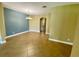 Open-concept living space featuring tile flooring and a striking blue accent wall at 30732 Lipizzan Ter, Mount Dora, FL 32757