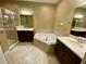 Elegant bathroom featuring a jacuzzi tub, separate shower, and dual vanities at 30732 Lipizzan Ter, Mount Dora, FL 32757