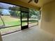 Screened in back porch with views of expansive yard at 30732 Lipizzan Ter, Mount Dora, FL 32757