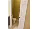 Powder room with toilet and door at 30732 Lipizzan Ter, Mount Dora, FL 32757