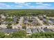 An aerial view of the neighborhood featuring a developed community and nearby lake at 3436 Gerber Daisy Ln, Oviedo, FL 32766