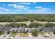 An aerial view of a well maintained home with landscaping and two car garage at 3436 Gerber Daisy Ln, Oviedo, FL 32766