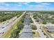 Aerial view showing roof and streetscape near commercial buildings and roadways at 3436 Gerber Daisy Ln, Oviedo, FL 32766