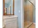 Bright bathroom features a shower stall and sink at 3436 Gerber Daisy Ln, Oviedo, FL 32766