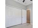 Bedroom featuring laminate floors, closet with sliding doors and a ceiling fan at 3436 Gerber Daisy Ln, Oviedo, FL 32766