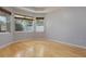 Bright bedroom with hardwood floors and natural light from windows at 3436 Gerber Daisy Ln, Oviedo, FL 32766