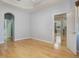 Open bedroom features vaulted ceilings and beautiful hardwood floors at 3436 Gerber Daisy Ln, Oviedo, FL 32766