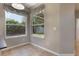 Bright dining area with tile flooring, two large windows and a view of the backyard at 3436 Gerber Daisy Ln, Oviedo, FL 32766