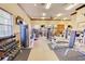 Brightly lit community gym with weight training equipment, exercise machines, and free weights at 3436 Gerber Daisy Ln, Oviedo, FL 32766