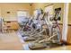 Community gym featuring cardio machines, window views, and posted health rules at 3436 Gerber Daisy Ln, Oviedo, FL 32766