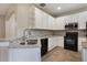 Kitchen featuring white cabinets, granite countertops, and stainless steel appliances at 3436 Gerber Daisy Ln, Oviedo, FL 32766