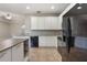 Kitchen with a center island, tile floors, granite countertops, and stainless steel appliances at 3436 Gerber Daisy Ln, Oviedo, FL 32766