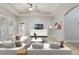 Spacious living room showcasing a modern design with hardwood floors and lots of natural light at 3436 Gerber Daisy Ln, Oviedo, FL 32766