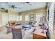 Community lounge with seating areas, ceiling fans, recessed lighting, and neutral color palette at 3436 Gerber Daisy Ln, Oviedo, FL 32766