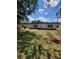Shows backyard with grass and a white house with two windows and a black roof at 3463 Fekany Pl, Orlando, FL 32805