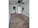 Spacious bedroom featuring ceiling fan, neutral walls, and carpet flooring at 3463 Fekany Pl, Orlando, FL 32805