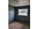 Cozy bedroom with a window offering natural light and views of the neighborhood at 3463 Fekany Pl, Orlando, FL 32805