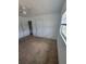 Bedroom features cozy carpet flooring, a window, and a ceiling fan at 3463 Fekany Pl, Orlando, FL 32805