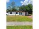 Charming single-story home featuring a well-maintained lawn and covered parking at 3463 Fekany Pl, Orlando, FL 32805