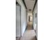Hallway with tile floors and baseboard trim at 3463 Fekany Pl, Orlando, FL 32805