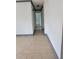 Neutral hallway featuring tile flooring that leads to other areas of the home at 3463 Fekany Pl, Orlando, FL 32805