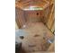 Image shows interior of unfinished shed with plywood flooring and exposed framing walls at 3463 Fekany Pl, Orlando, FL 32805