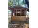 Shows unfinished shed with exposed framing and some plywood siding in a grassy yard at 3463 Fekany Pl, Orlando, FL 32805