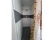 Modern shower with white marble and black tiled accents, featuring sunflower curtain at 3463 Fekany Pl, Orlando, FL 32805