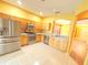 Bright eat-in kitchen with stainless steel appliances and tile floors at 402 Ravenshill Way, Deland, FL 32724