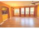 Living room with wood floors, lots of natural light and bar seating at 402 Ravenshill Way, Deland, FL 32724