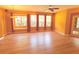 Spacious living room featuring hardwood floors and natural light at 402 Ravenshill Way, Deland, FL 32724