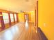 Spacious living room with a ceiling fan, neutral color and hardwood floors at 402 Ravenshill Way, Deland, FL 32724