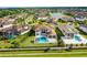 Beautiful aerial view of home with backyard pool, green lawn, and a private fence at 4065 Isabella Cir, Windermere, FL 34786