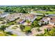 This aerial shows an estate home on a verdant lot with circular driveway and lush landscaping at 4065 Isabella Cir, Windermere, FL 34786