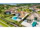 Expansive backyard featuring a private pool, lush landscaping, and an outdoor entertainment area, perfect for relaxation at 4065 Isabella Cir, Windermere, FL 34786