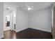 Bright bedroom with ceiling fan, hardwood floors, and natural light. Includes a view of the laundry room at 4065 Isabella Cir, Windermere, FL 34786