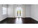 Bright bedroom with hardwood floors and a private balcony at 4065 Isabella Cir, Windermere, FL 34786