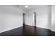 Spacious bedroom boasts a ceiling fan, dark hardwood floors, and bright white walls at 4065 Isabella Cir, Windermere, FL 34786