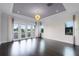 Spacious bedroom with high ceilings, dark hardwood floors, and balcony access at 4065 Isabella Cir, Windermere, FL 34786