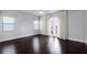 Inviting bedroom with a ceiling fan, dark hardwood floors, and balcony access offering natural light at 4065 Isabella Cir, Windermere, FL 34786