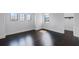 Light and airy bedroom with gleaming hardwood floors, white walls, and natural light at 4065 Isabella Cir, Windermere, FL 34786