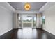 Bright, airy bedroom with hardwood floors and balcony access offering scenic views at 4065 Isabella Cir, Windermere, FL 34786